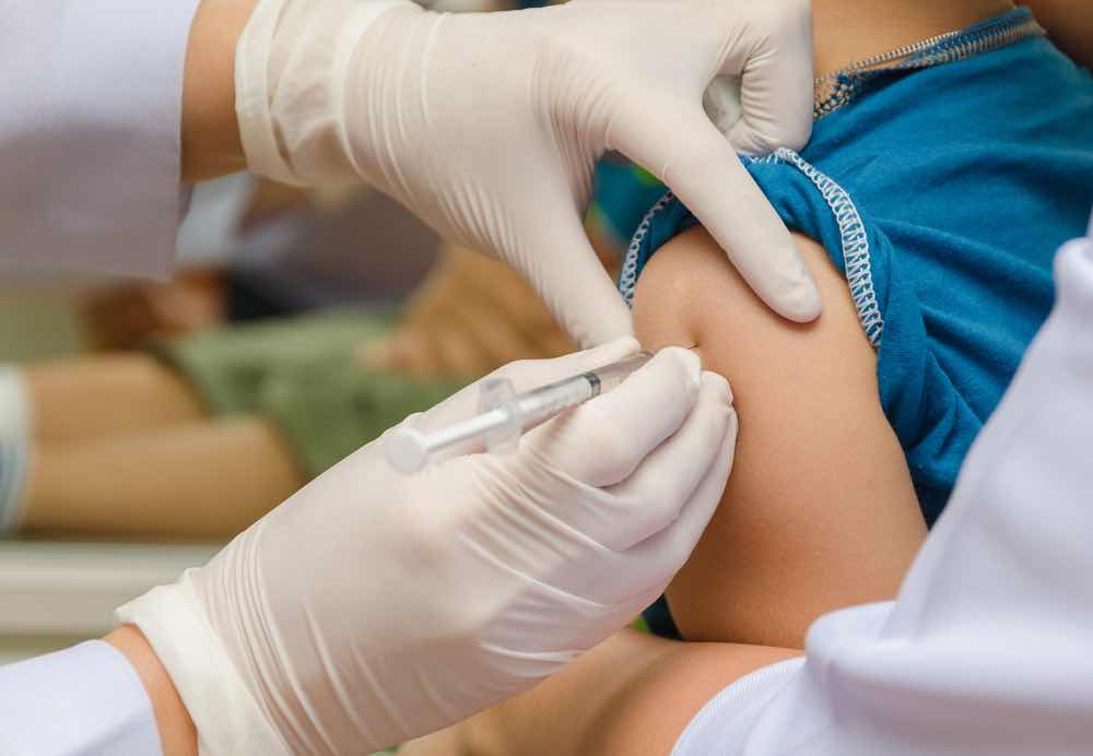 Child receiving vaccination immunization shot