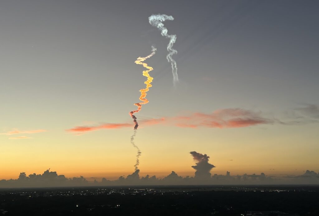 Fuel trail of Atlas V rocket over downtown Orlando on August 4