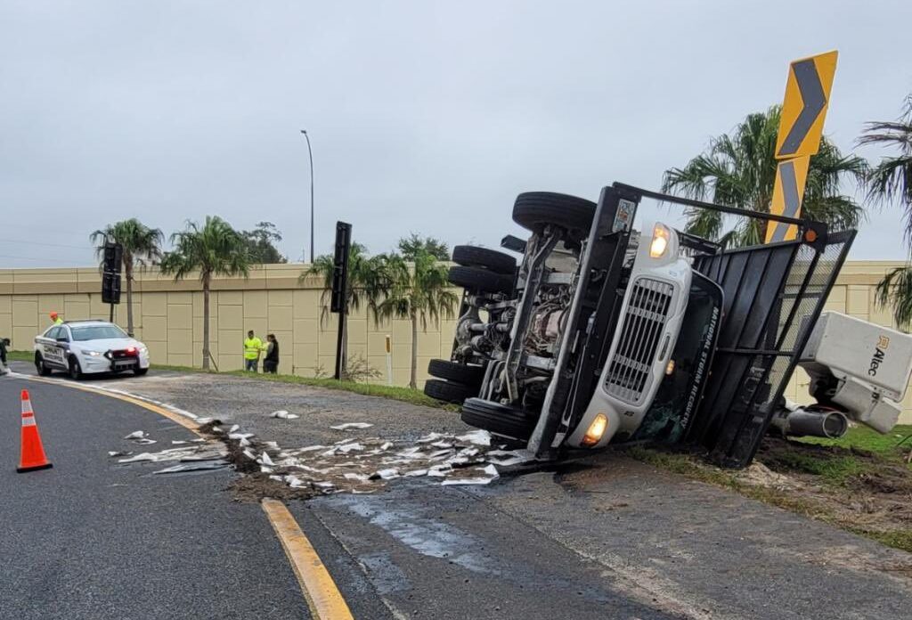 Truck flips over on SR 408