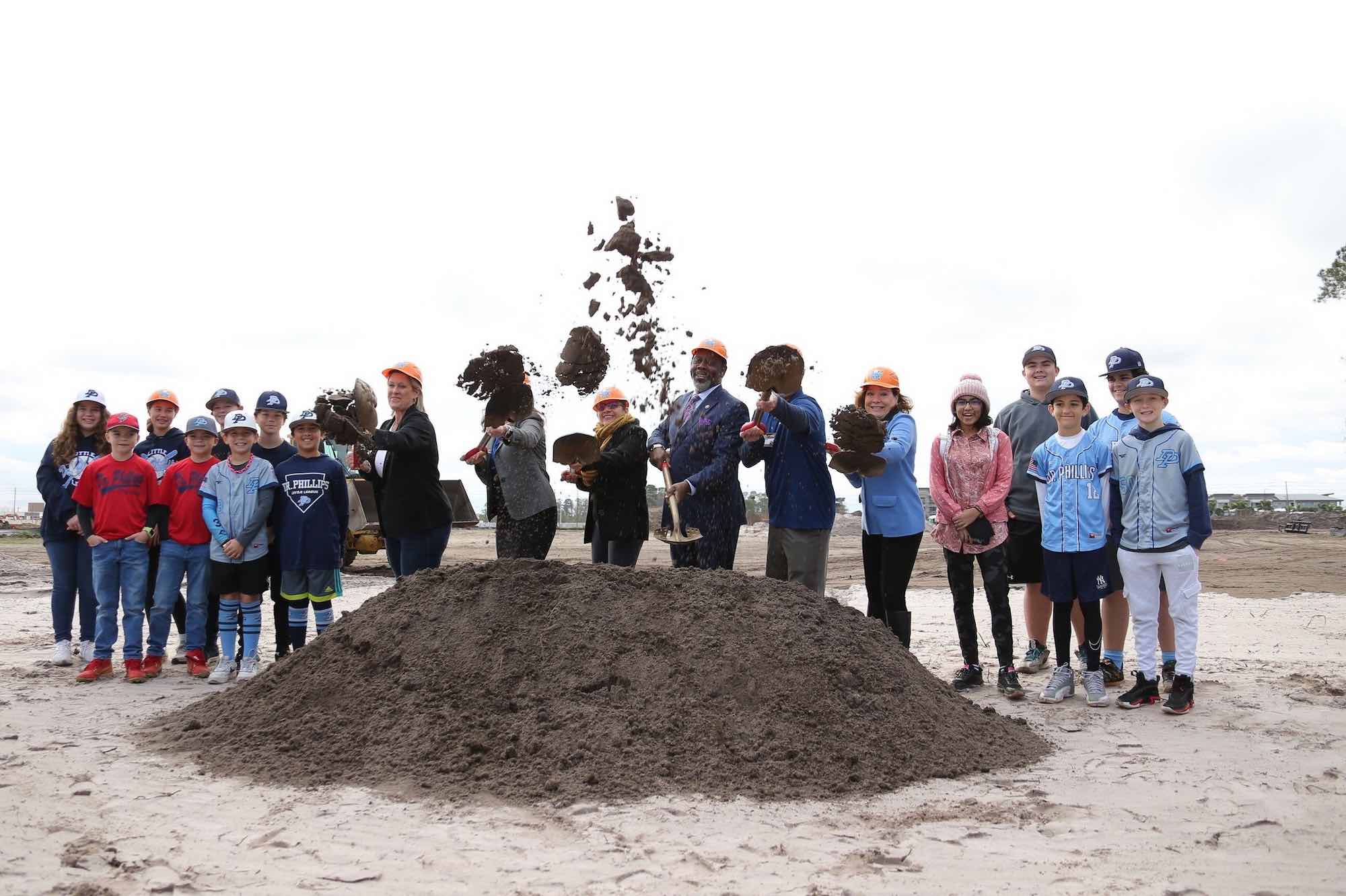 Orange County officials toss dirt at ground breaking of Dr. Phillips Little League Complex