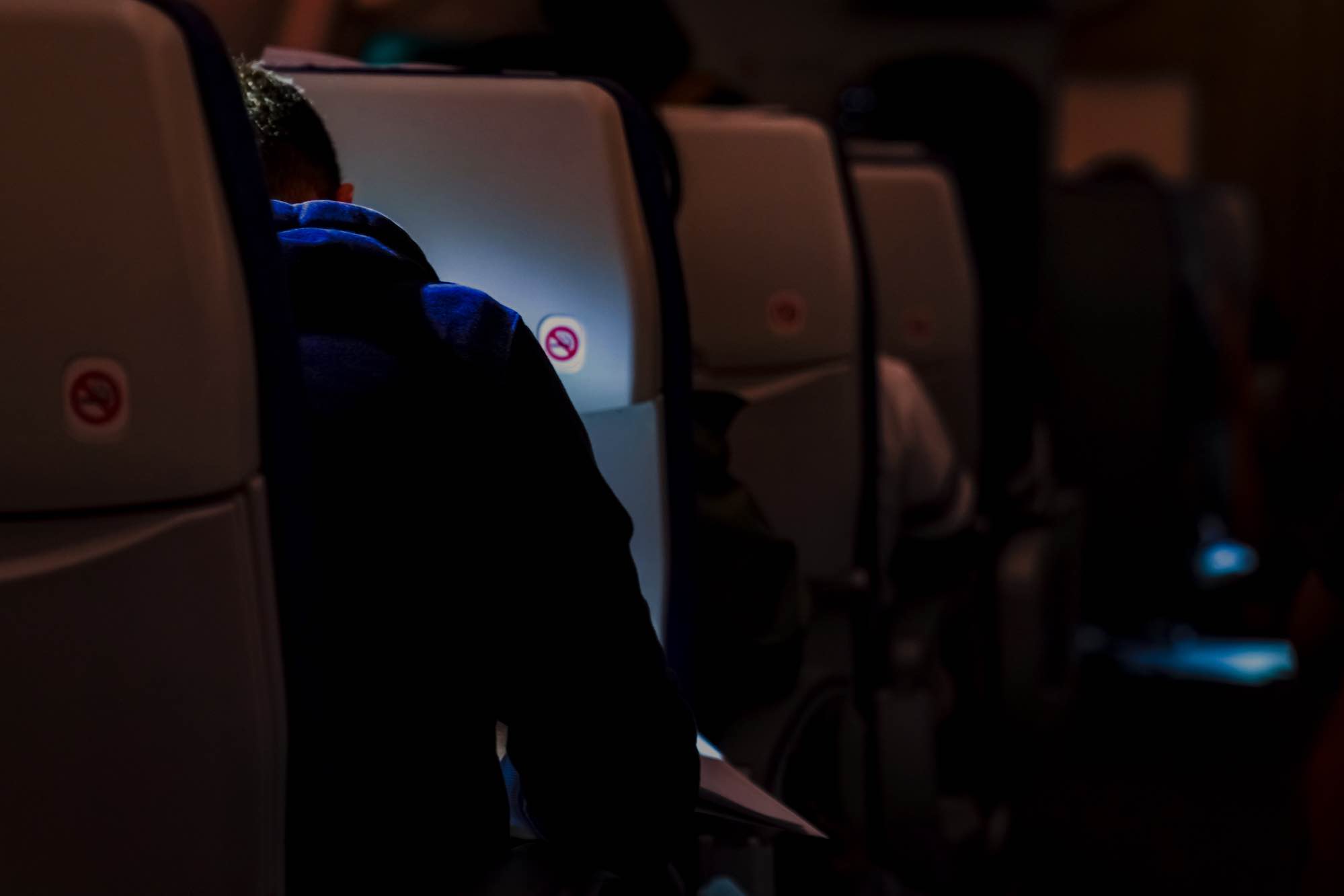 Airplane cabin seats dimmed for takeoff