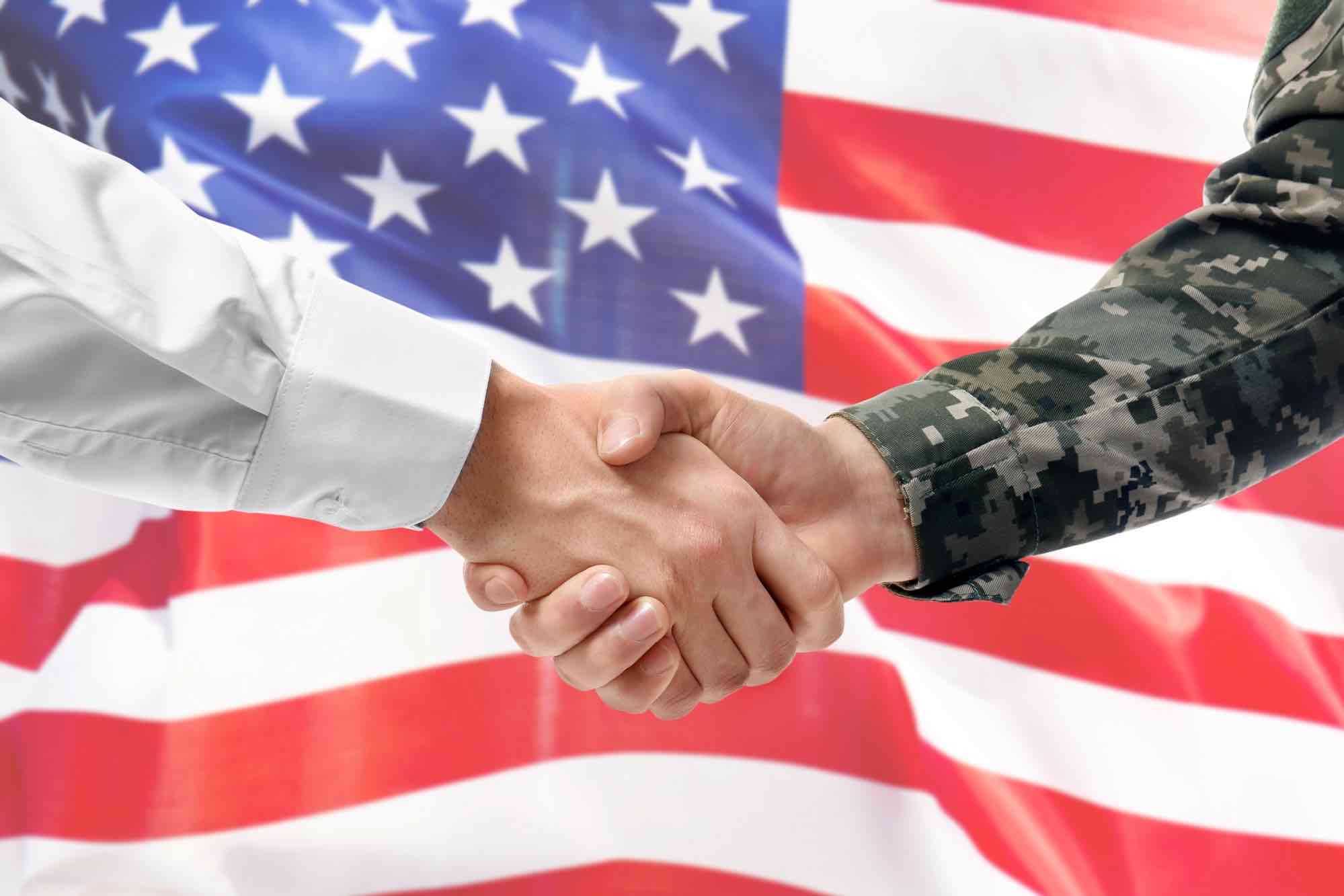 Veterans soldier shaking hand for business owner offering job