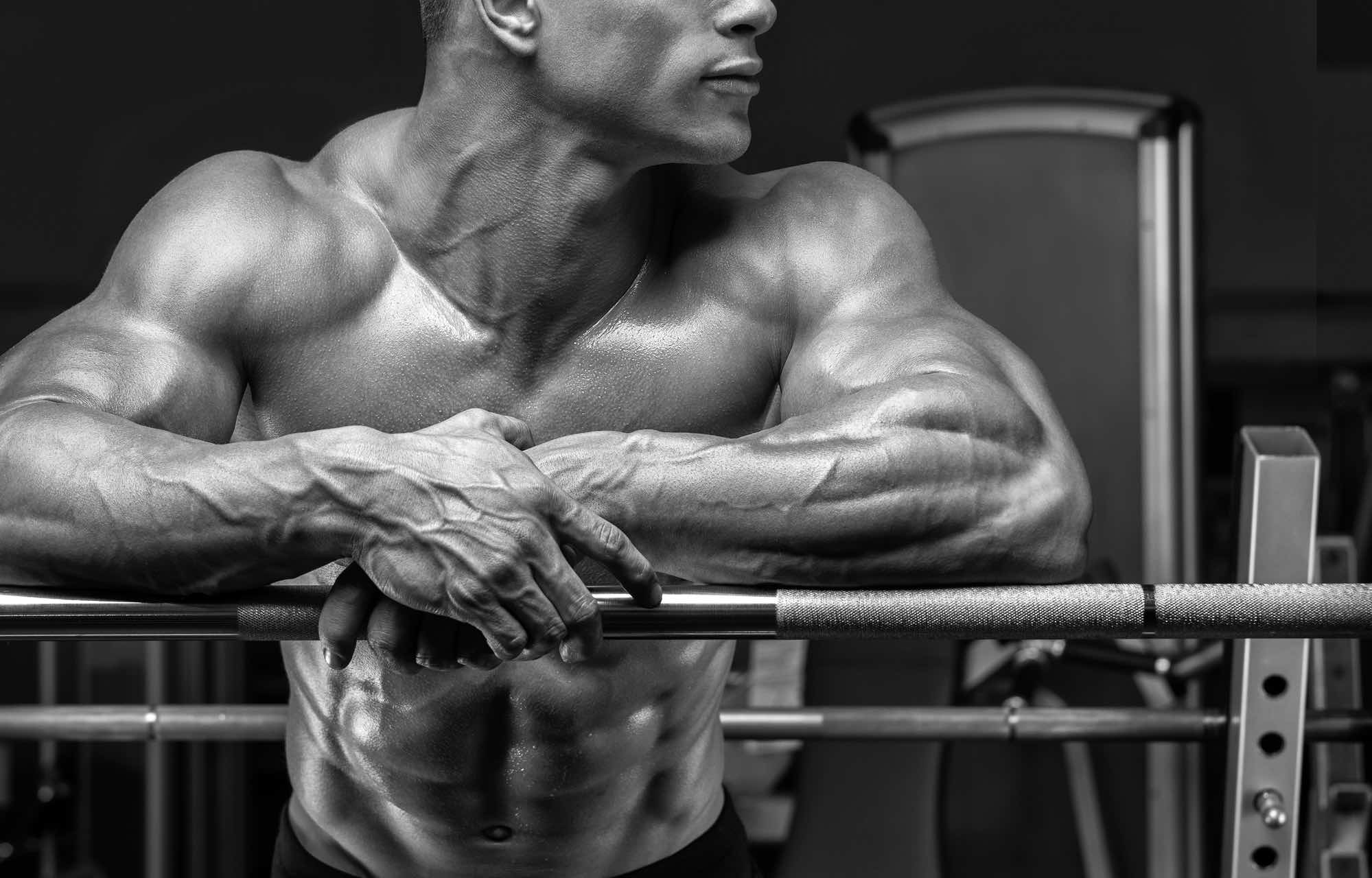 Bodybuilder prepare to do exercises with barbell