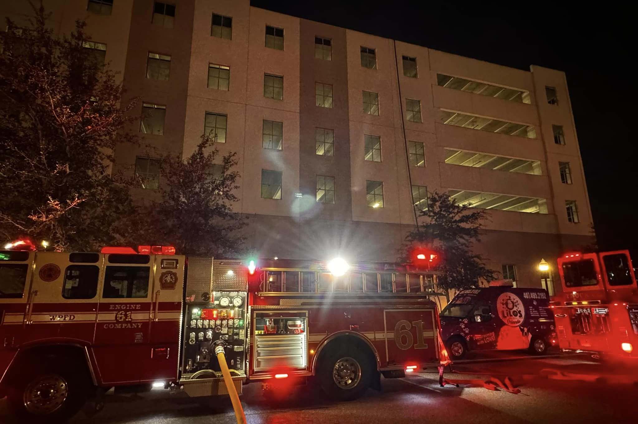 Crews outside of a parking garage in Winter Park on December 18