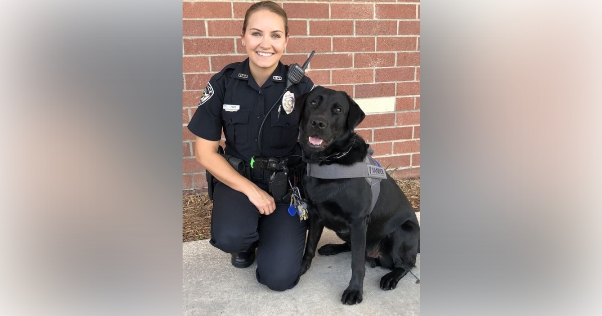 OPD School Resource Officer Ashley Pierce with comfort K 9 Xander (Photo: Oviedo Police Department)