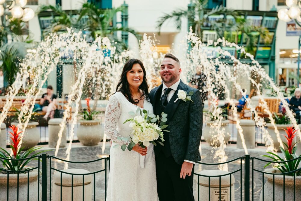 Kayla left and Tommy right recently got married at Orlando International Airport. Photo by The Lemons Photography