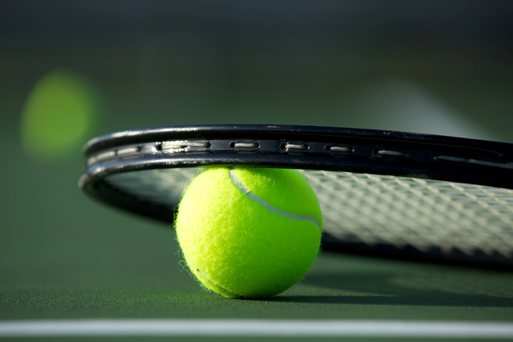 Tennis ball and racket feature image